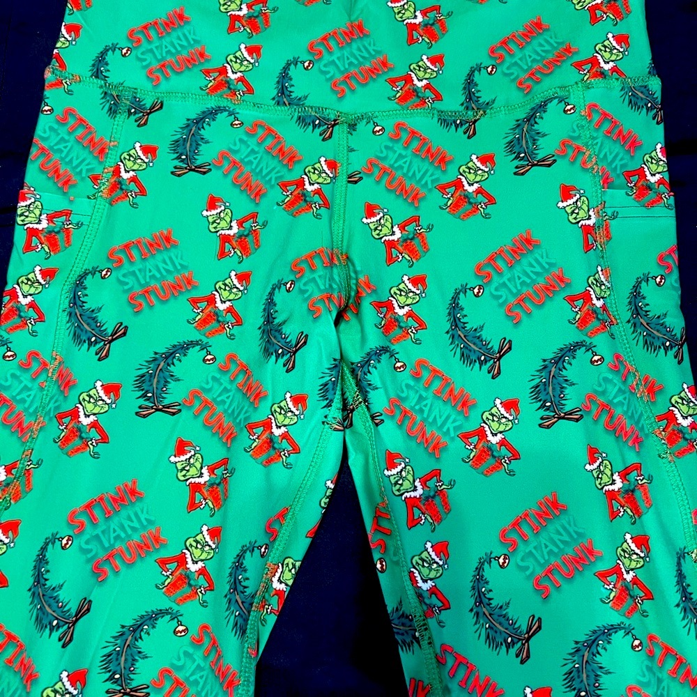Spread the Holiday Cheer wearing a pair of The Grinch Leggings!
